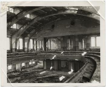 [Interior of Hiroshima City Hall auditorium with undamaged walls and framing but spalling of plaster and complete destruction of contents by fire], November 1, 1945.